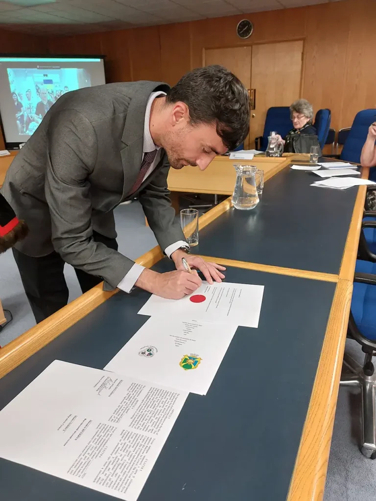 Swanley CEO signing officd twinning agreement